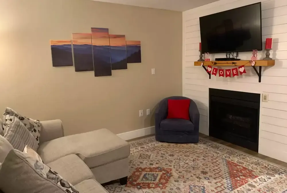 Laurel Inn Condo 202 living room with fireplace decorated for Valentine's Day