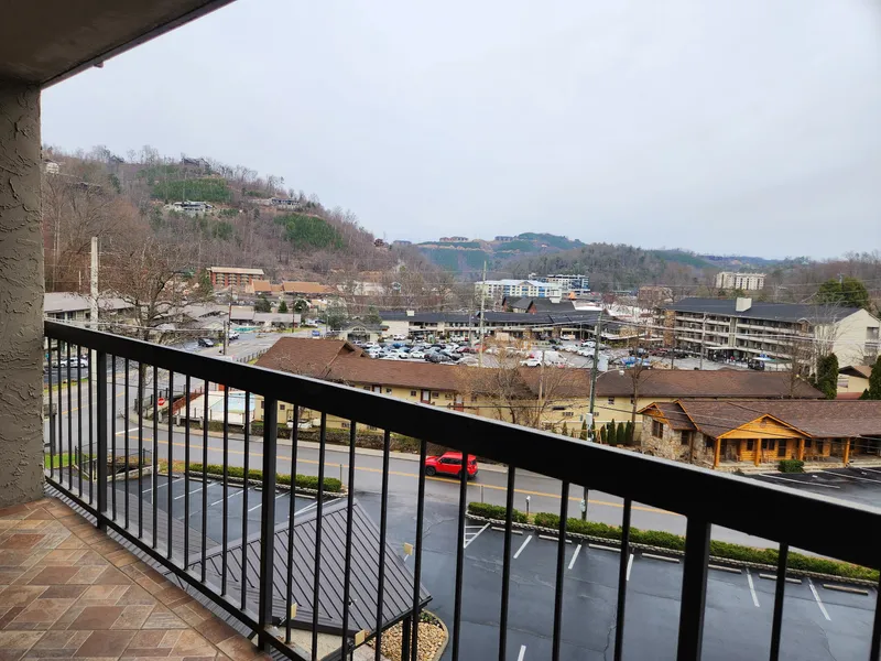 Expansive mountain vista from your private balcony overlooks the bustling valley below.
