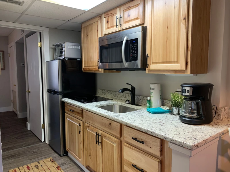 Your fully equipped kitchen awaits with granite counters, stainless appliances, and everything needed for memorable meals together.