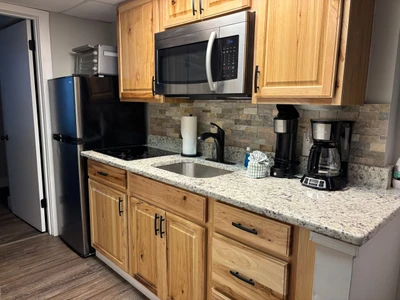 Your fully-equipped kitchen features granite counters, modern appliances, and everything you need to prepare meals at your leisure.