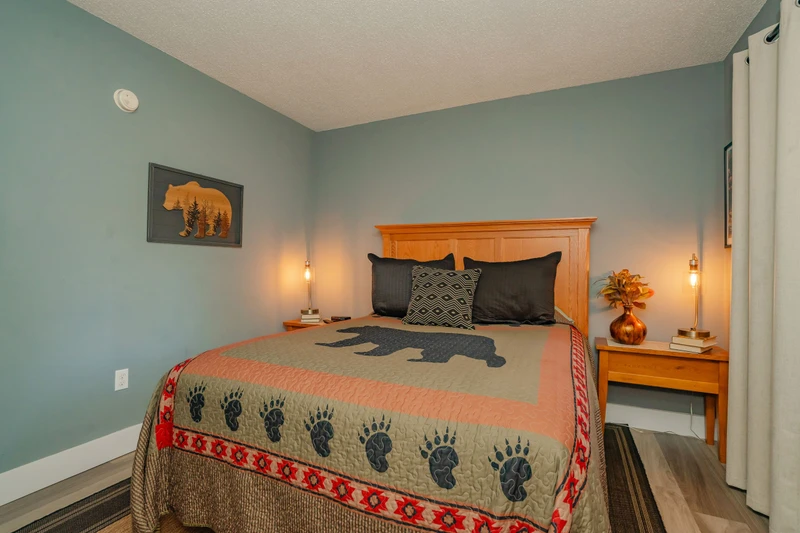 Unwind in your restful bedroom with rustic charm, soft lighting, and cozy bedding designed to help you sleep soundly after a day of adventure.