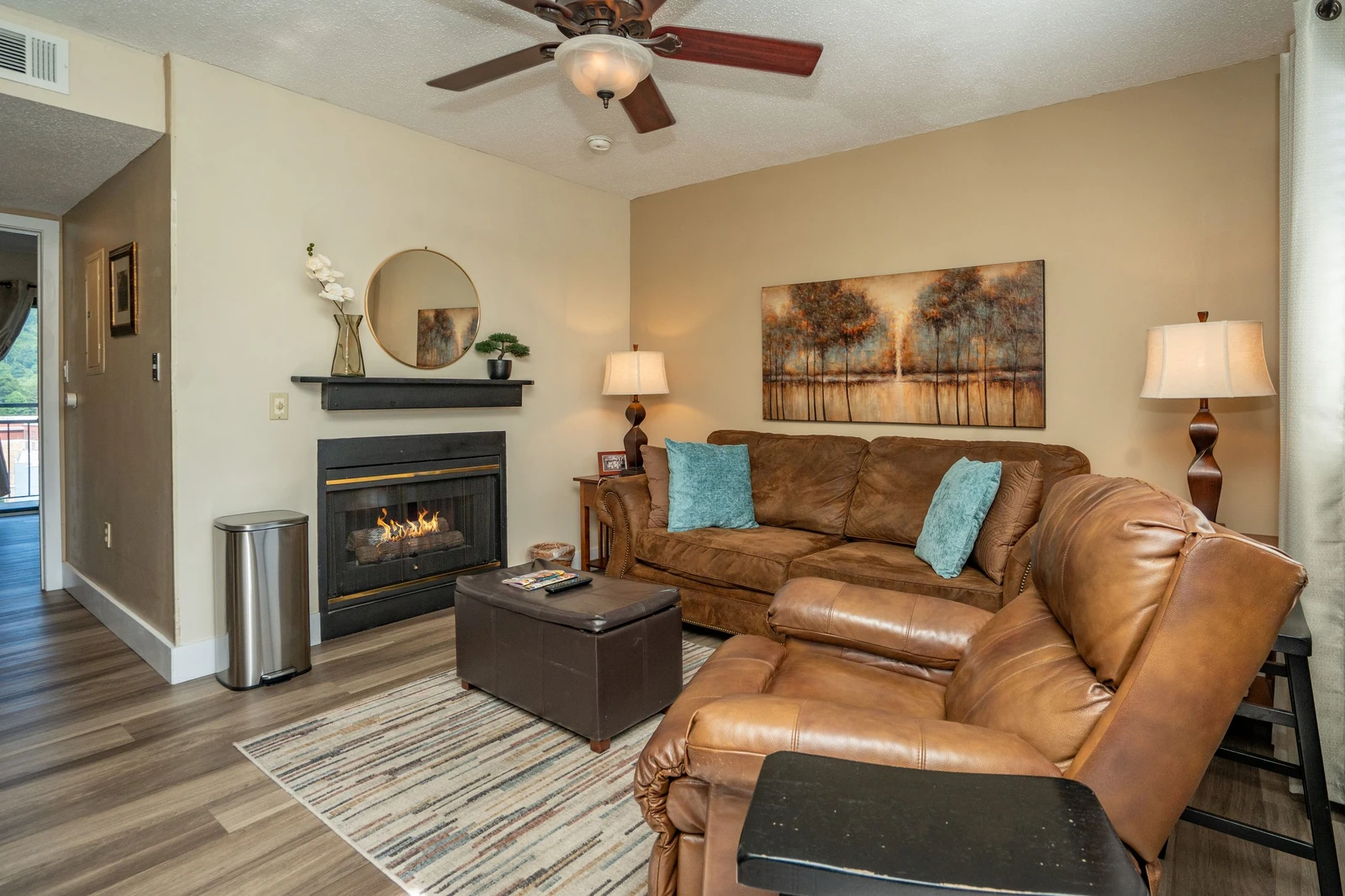 Sink into plush leather seating by your own cozy fireplace, perfect for unwinding after exploring the area. Warm tones and thoughtful touches make this inviting space feel like home.
