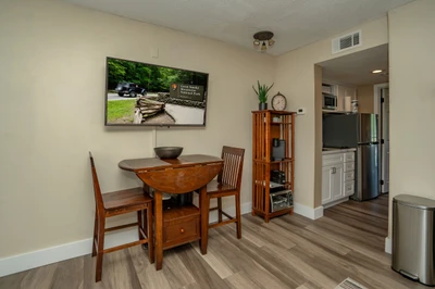 Settle in at your cozy dining nook, where a large TV and full kitchen just steps away set the stage for relaxed meals and entertaining.
