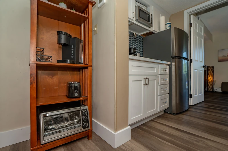 Your fully equipped kitchen features modern appliances and a thoughtful coffee station, perfect for starting your mornings at your own pace.