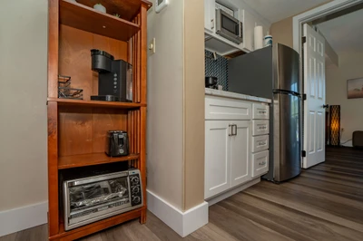 Your fully equipped kitchen features modern appliances and a thoughtful coffee station, perfect for starting your mornings at your own pace.