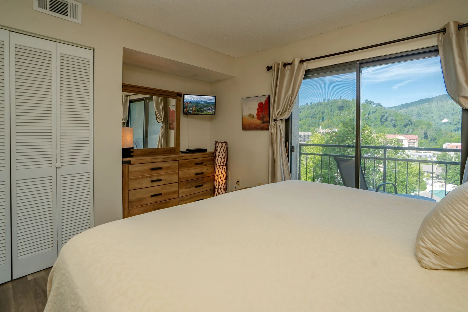 Wake up to serene mountain views from your comfortable bedroom. Enjoy crisp air conditioning, smart TV entertainment, and a private balcony where you can sip morning coffee surrounded by lush greenery.