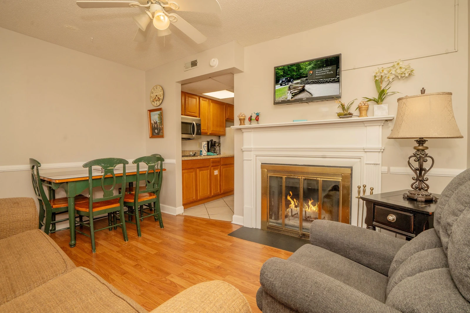 Unwind in your cozy living space where a crackling fireplace and comfortable seating invite you to relax after a day of exploring the Smokies.