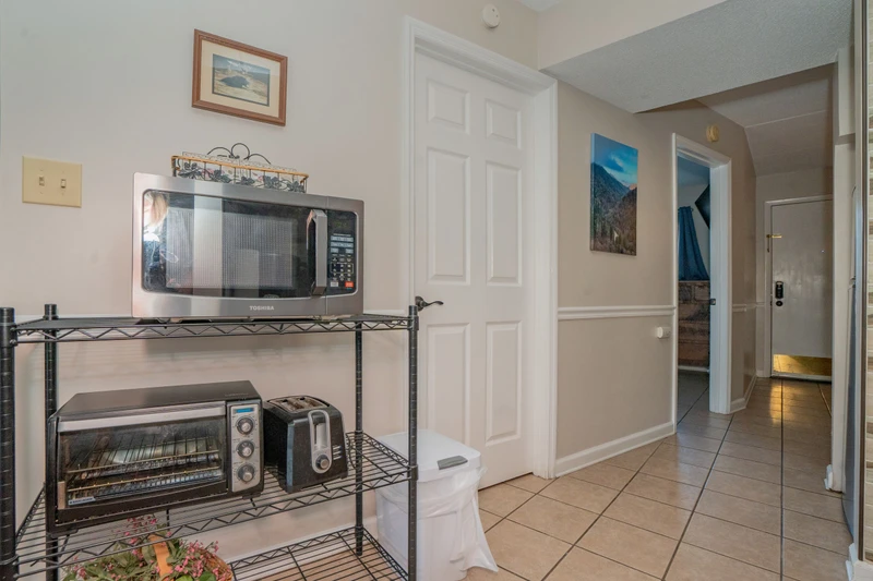 A convenient kitchenette with microwave, toaster oven, and coffee maker ready for your morning routine and quick meals during your stay.