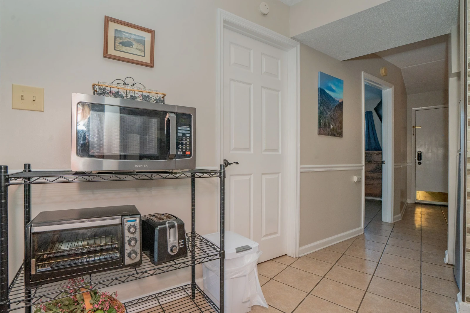 A convenient kitchenette with microwave, toaster oven, and coffee maker ready for your morning routine and quick meals during your stay.