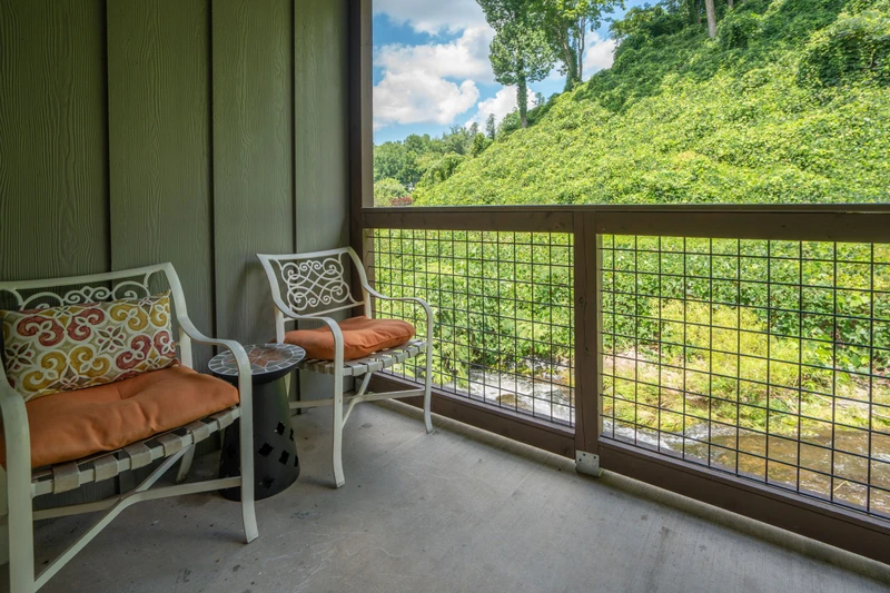 Settle into your private balcony and let the lush hillside views sweep you away—perfect for morning coffee or unwinding after a day of adventure.