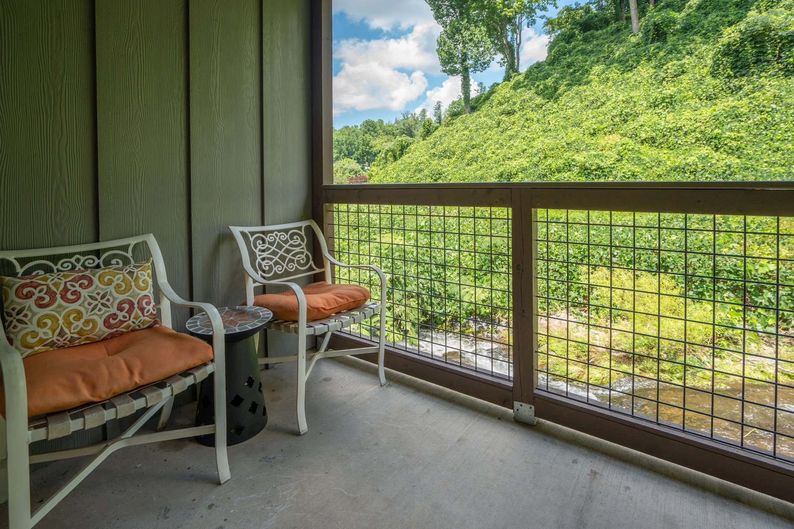 Settle into your private balcony and let the lush hillside views sweep you away—perfect for morning coffee or unwinding after a day of adventure.