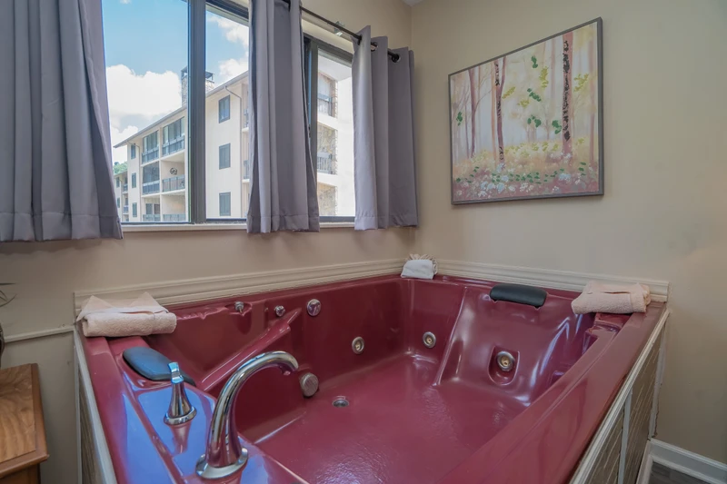 Slip into your private jetted tub and let the warm, bubbling water melt away the day. With soft towels at hand and natural light streaming in, this is your personal sanctuary for relaxation.