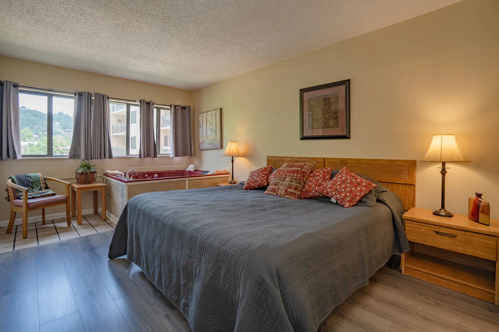 Wake up to soft light streaming through your windows and enjoy a restful retreat in this cozy bedroom. Warm wood tones and thoughtful touches create a welcoming space where you can truly unwind.