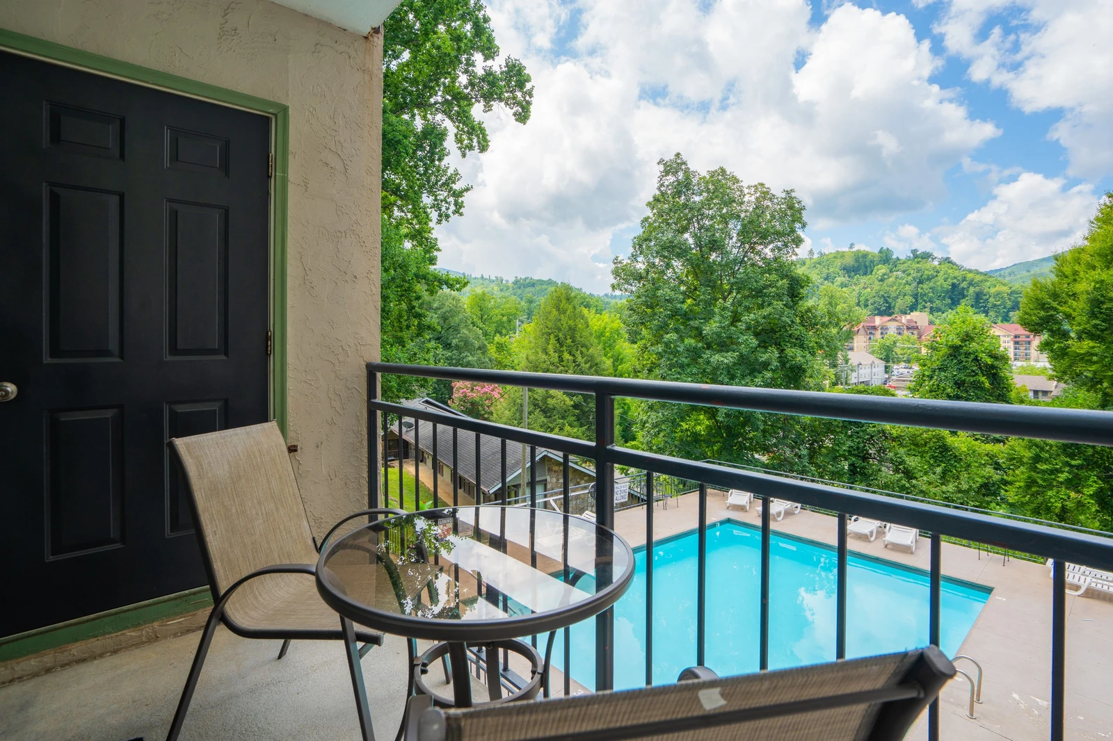 Step out onto your private balcony and take in the refreshing mountain views, lush greenery, and sparkling pool below—perfect for morning coffee or evening unwind.