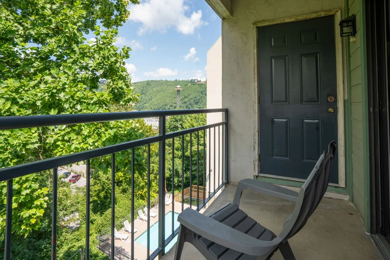 Step onto your private balcony and breathe in the fresh mountain air. Lush greenery frames stunning hillside views, offering a peaceful retreat where you can relax and unwind above it all.