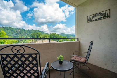 Step out onto your private balcony and breathe in the fresh mountain air. Enjoy morning coffee or evening relaxation with breathtaking views of the rolling Smoky Mountains.