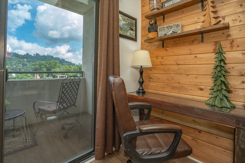Settle into your cozy reading nook with rustic wood accents and step onto your private balcony to take in the surrounding mountain landscape and fresh air.