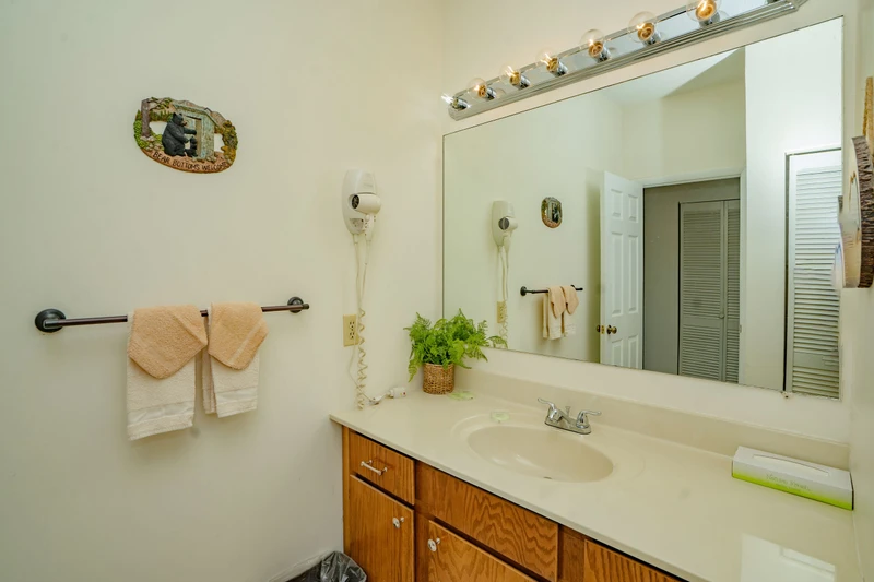 Step into your private bathroom, where fresh towels and a warm, inviting space await you after a day of adventure.