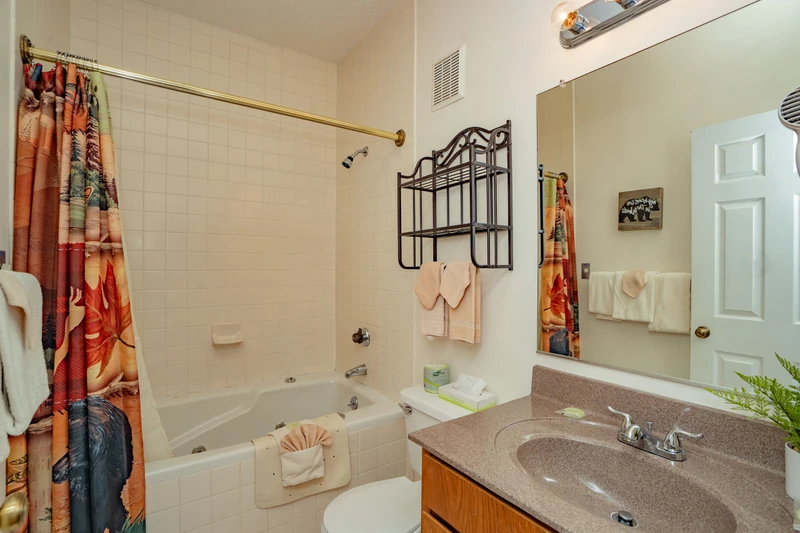 Refresh in your bright, full bathroom with a tub-shower combo, fresh towels, and a handy vanity area for all your essentials.