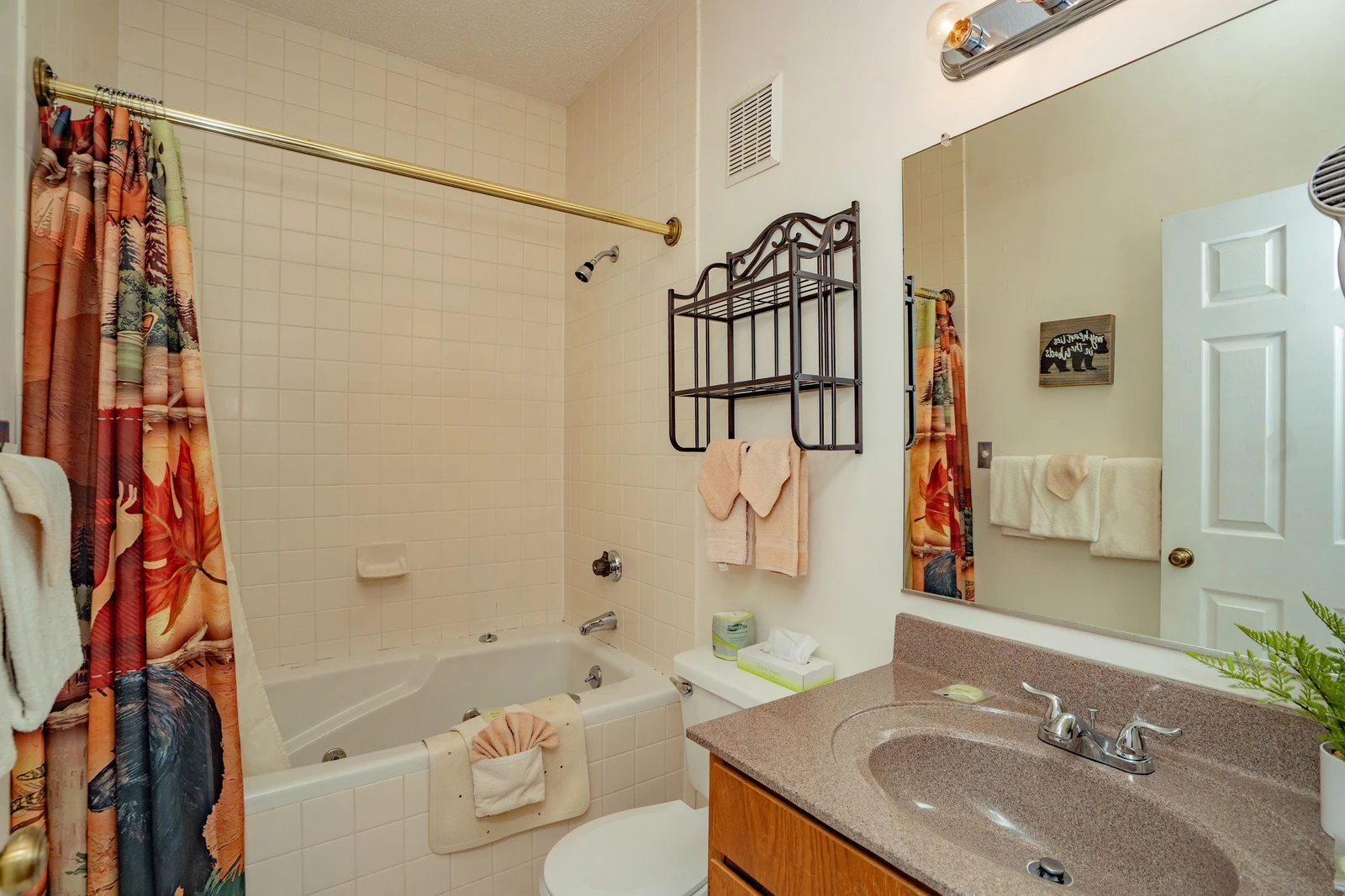 Refresh in your bright, full bathroom with a tub-shower combo, fresh towels, and a handy vanity area for all your essentials.