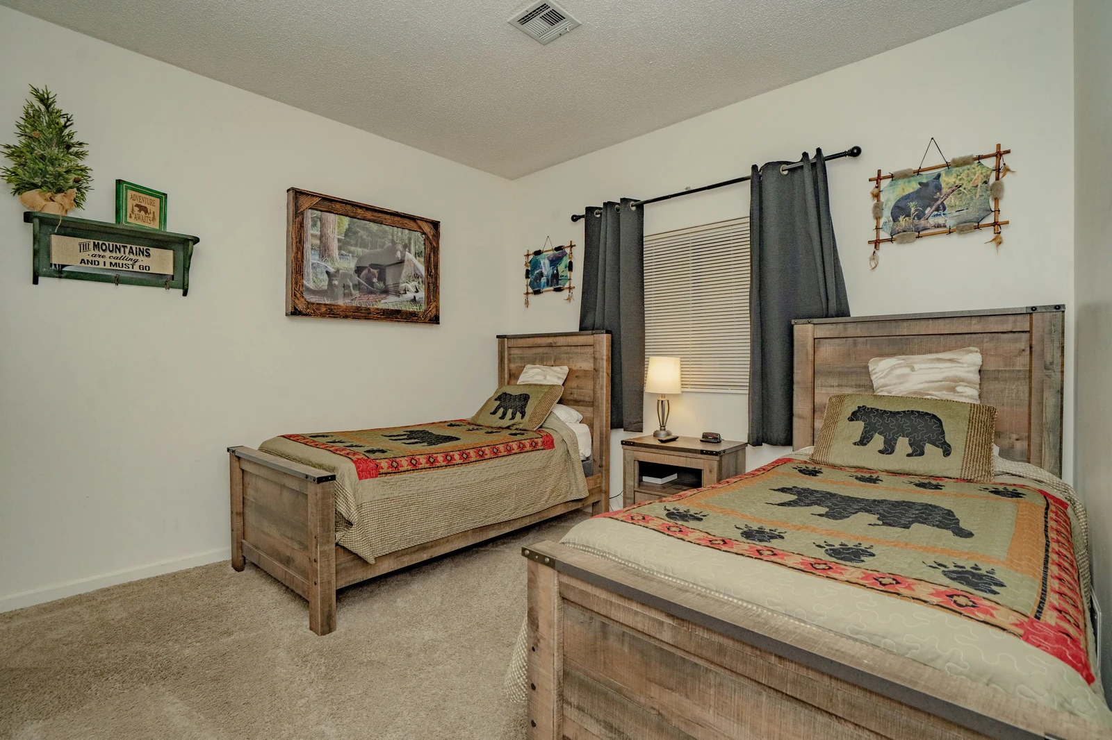 Rustic twin beds with charming cabin-inspired décor await your little adventurers, creating a cozy woodland retreat where bedtime stories come alive and childhood memories are made.