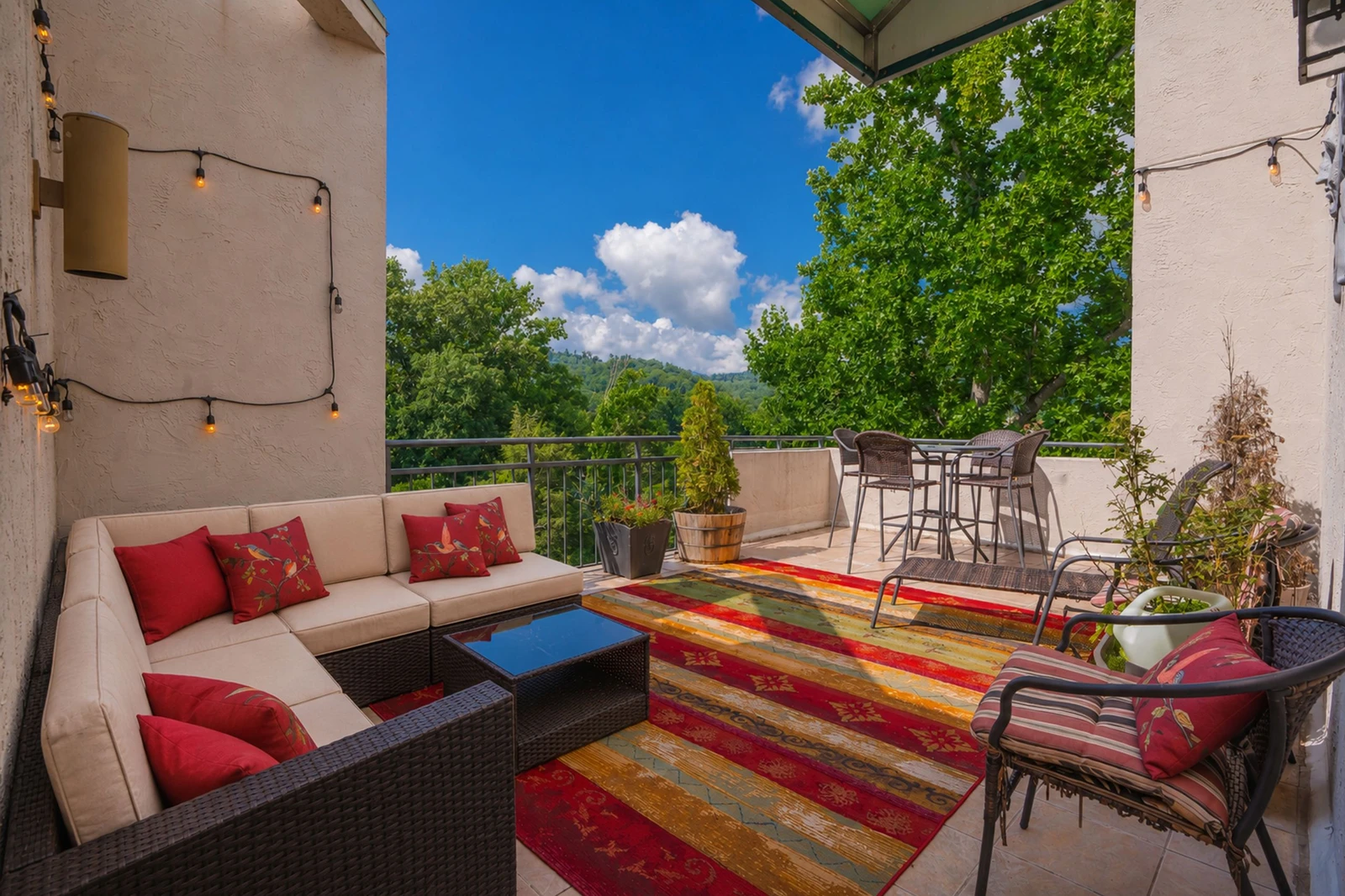 Relax on your private rooftop terrace with sweeping views of lush rolling hills and vibrant greenery—perfect for morning coffee or sunset cocktails under the open sky.
