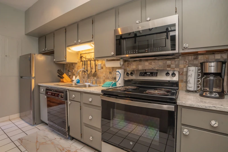 Your fully equipped kitchen awaits, complete with modern appliances and everything you need to prepare your favorite meals during your stay.