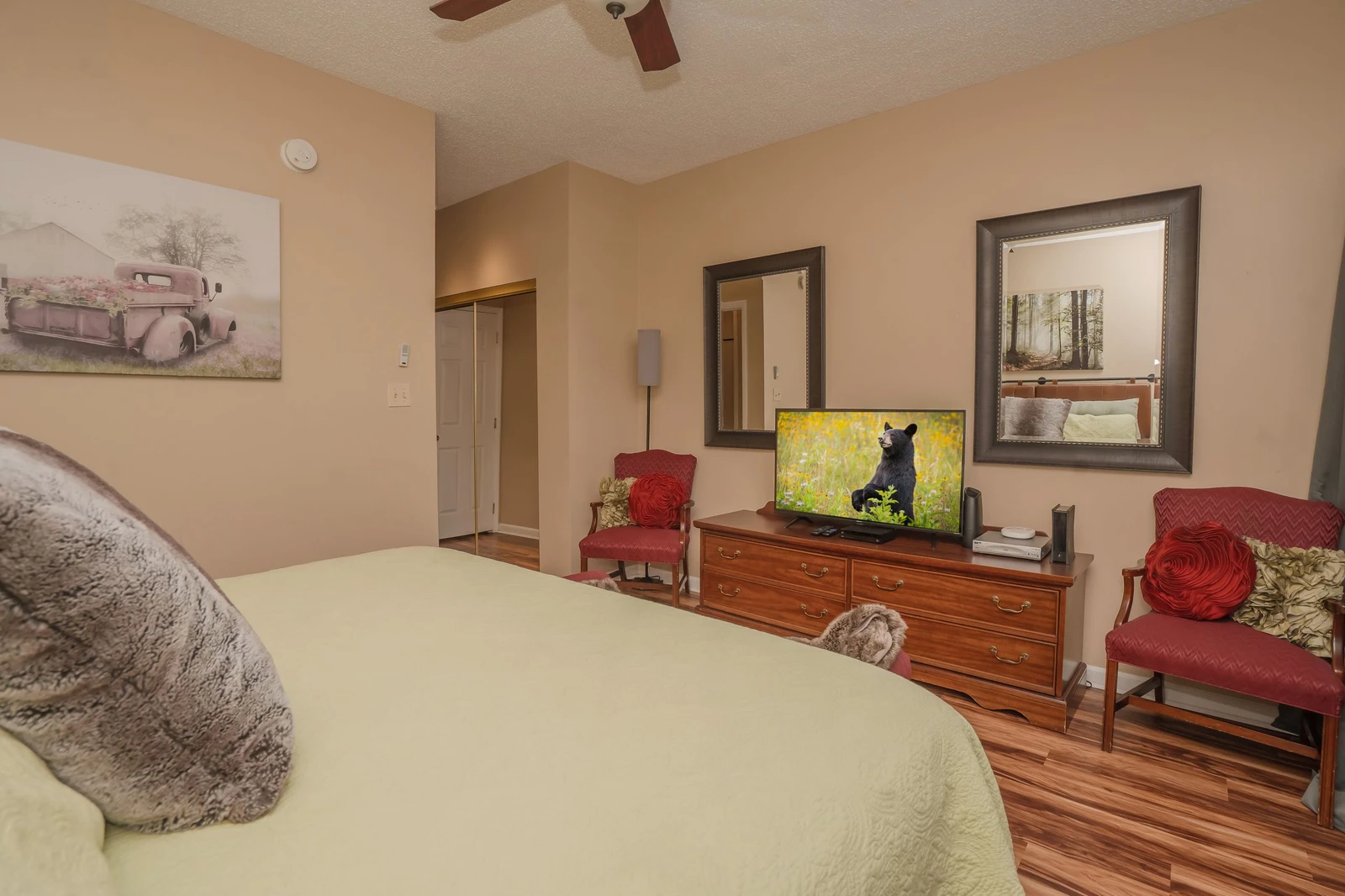 Unwind in your peaceful bedroom retreat, where warm tones and charming decor create a cozy haven. Plush seating, stylish furnishings, and thoughtful touches ensure every moment of your stay feels like home.