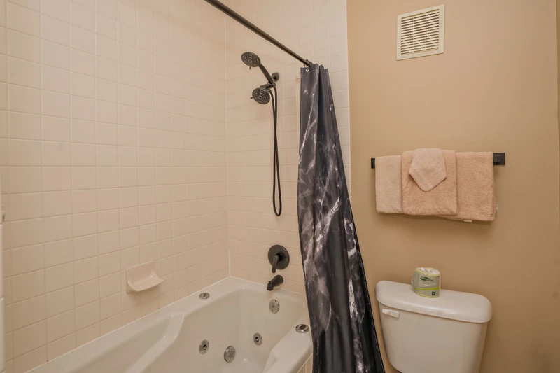Unwind in your private bathroom featuring a soothing jetted tub, perfect for melting away stress after a day of adventure. Fresh towels await your arrival.