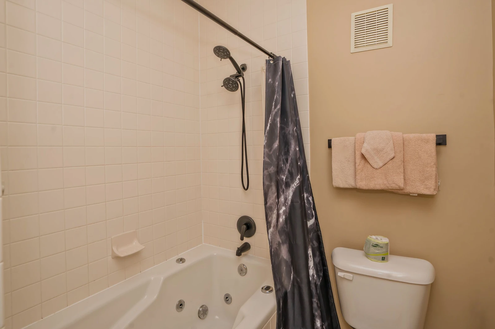 Unwind in your private bathroom featuring a soothing jetted tub, perfect for melting away stress after a day of adventure. Fresh towels await your arrival.