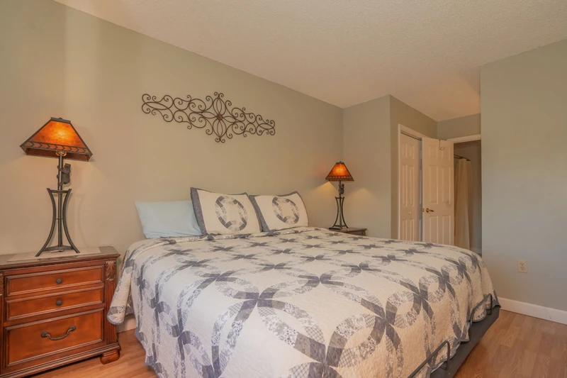 Step into your serene bedroom retreat, where soft lighting and thoughtful touches create a peaceful space for rest and relaxation after your day's adventures.
