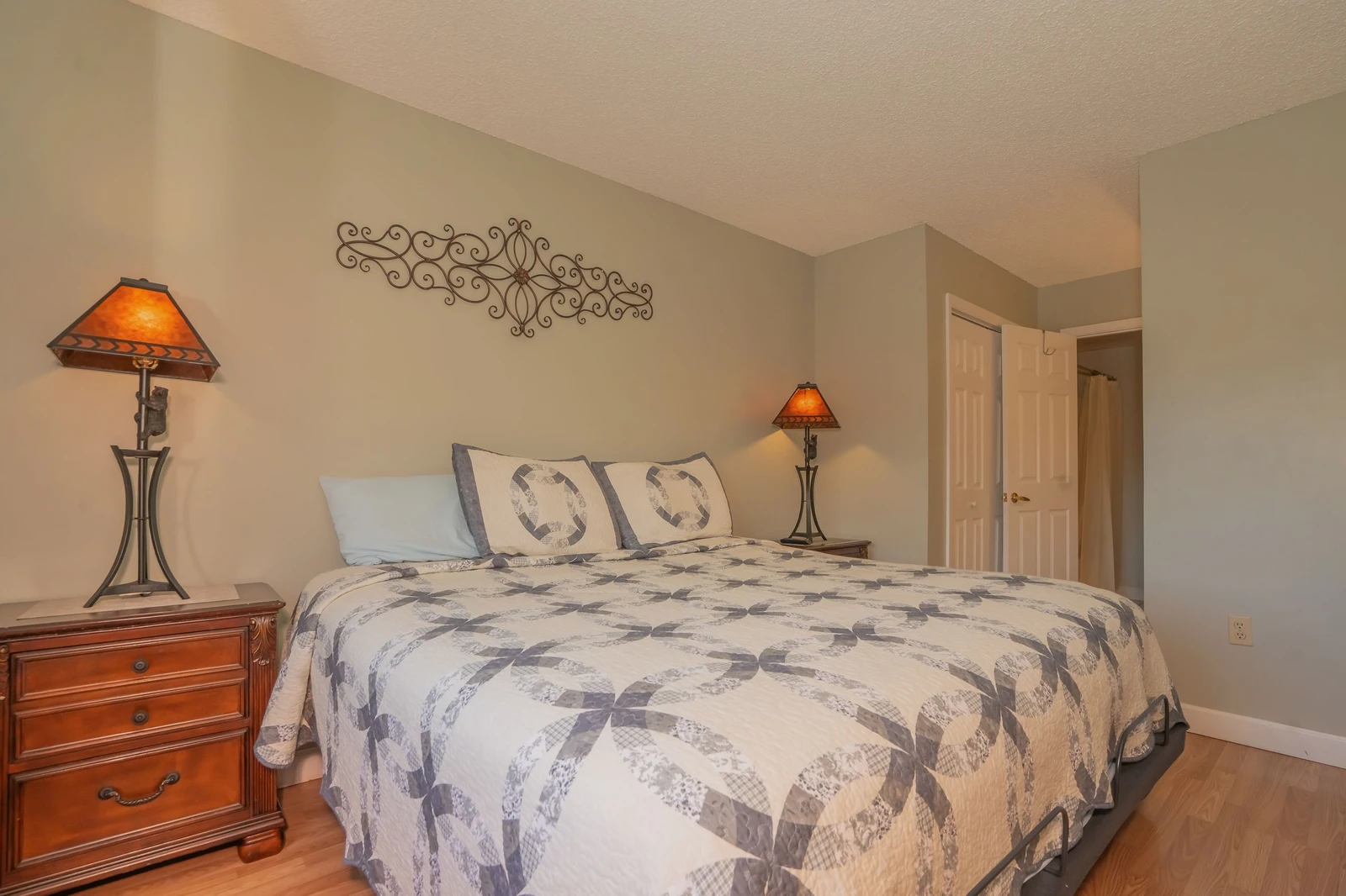 Step into your serene bedroom retreat, where soft lighting and thoughtful touches create a peaceful space for rest and relaxation after your day's adventures.