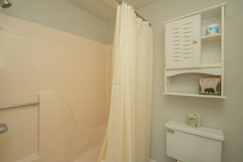 Your private bathroom features a refreshing shower and thoughtful storage, ensuring a comfortable stay with everything you need close at hand.