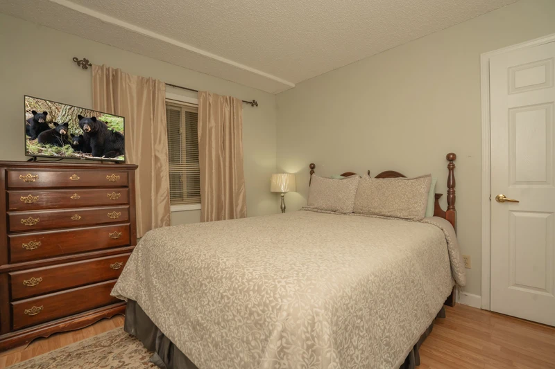 Slip into soft linens and unwind in your peaceful guest bedroom, complete with elegant wood furnishings and your own TV for cozy evenings in.