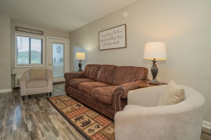 Settle into this inviting living room with comfortable seating and warm lighting, perfect for relaxing after your day's adventures.