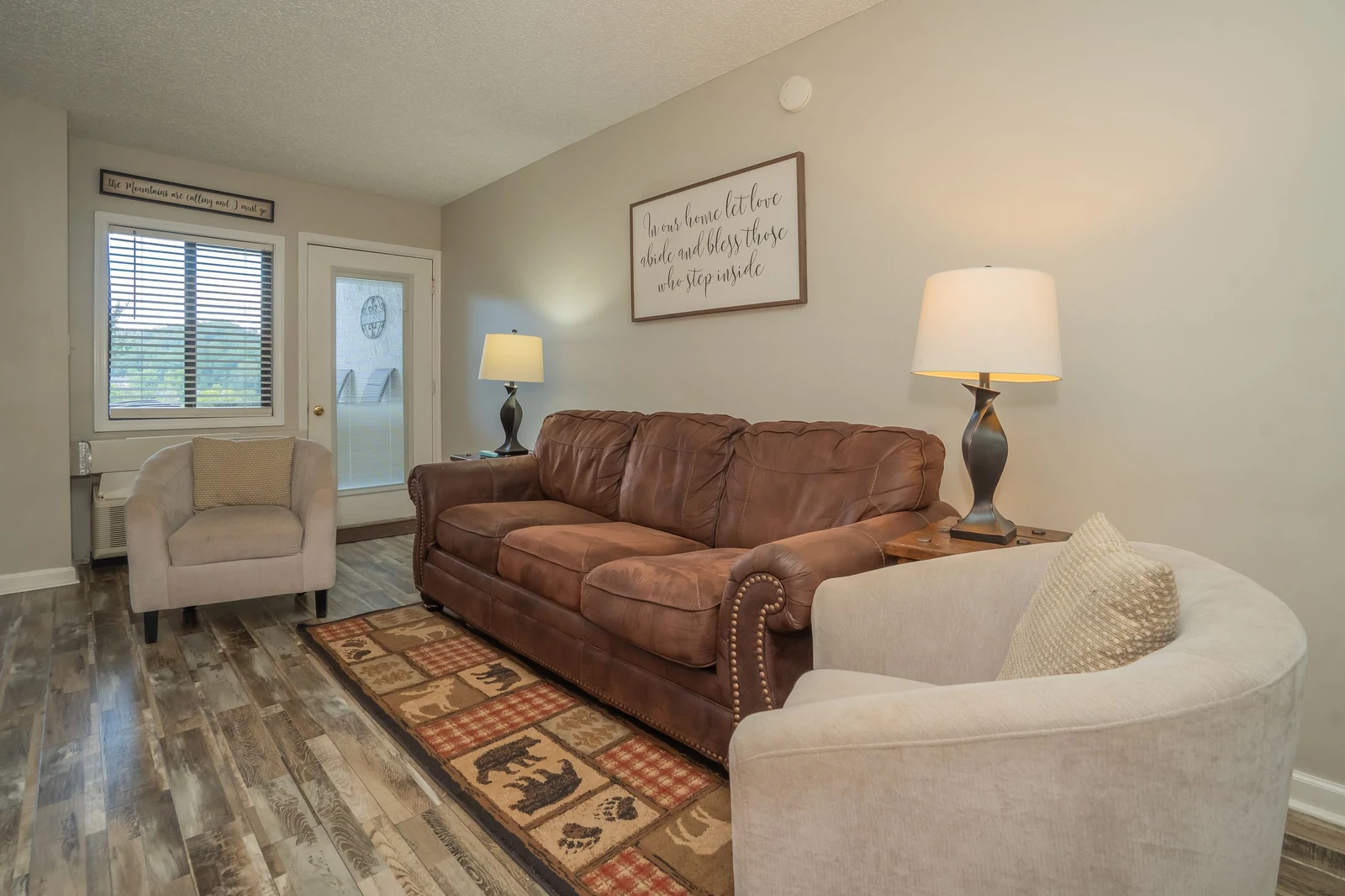 Settle into this inviting living room with comfortable seating and warm lighting, perfect for relaxing after your day's adventures.