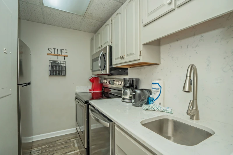 Your fully equipped kitchen makes meal prep a breeze, with sleek countertops, modern appliances, and all the essentials you need to feel right at home.
