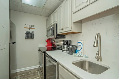 Your fully equipped kitchen makes meal prep a breeze, with sleek countertops, modern appliances, and all the essentials you need to feel right at home.