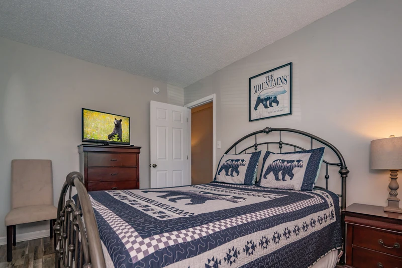 Settle into your cozy bedroom retreat with a plush bed and thoughtful touches that make this space feel like home.