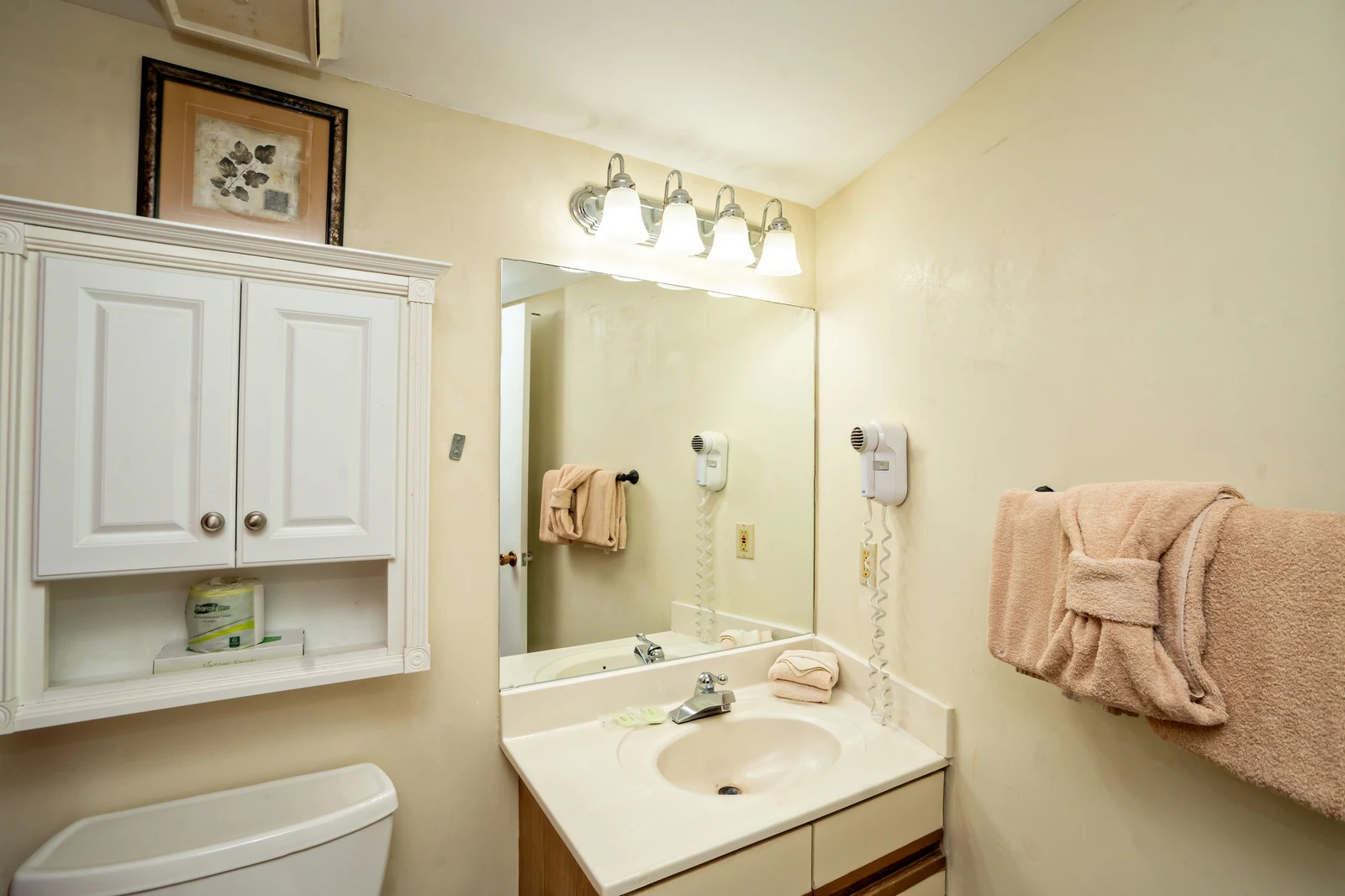 Freshen up in your private bathroom, complete with soft towels, a well-lit vanity, and thoughtful touches like convenient hair dryers.