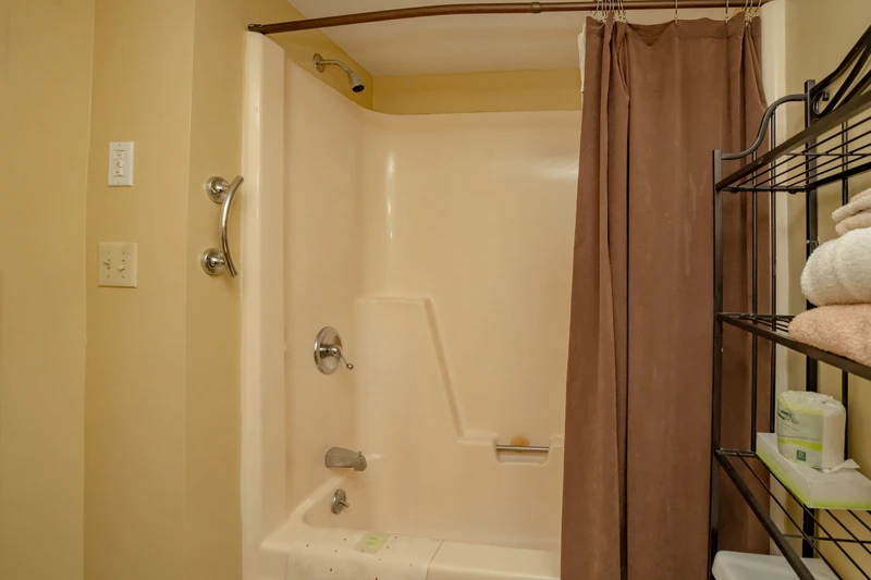 Step into your spotless bathroom with a sparkling tub-shower combo, soft towels at the ready, and all the comforts you need for a refreshing soak or quick rinse after a day of adventure.