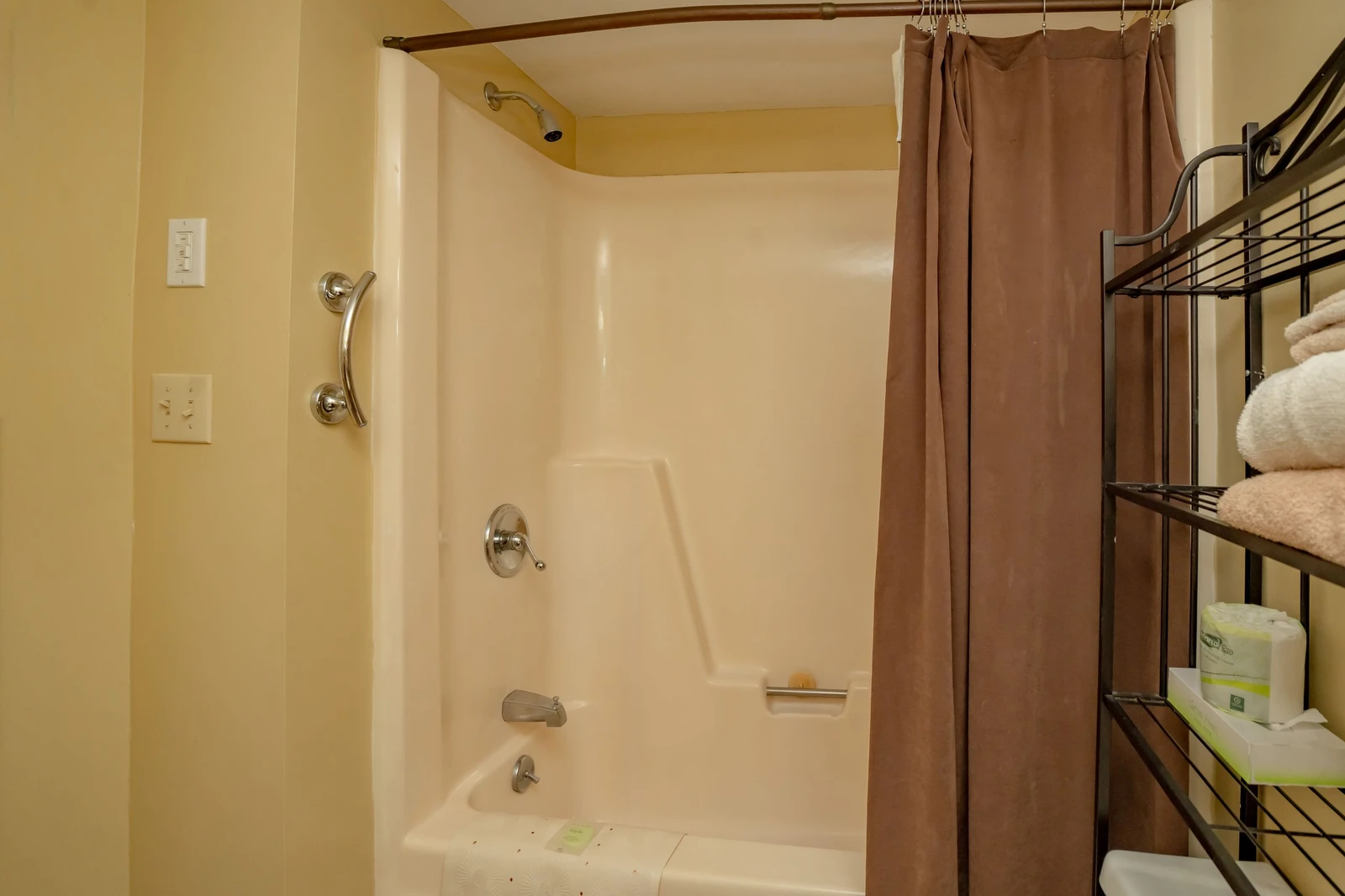Step into your spotless bathroom with a sparkling tub-shower combo, soft towels at the ready, and all the comforts you need for a refreshing soak or quick rinse after a day of adventure.