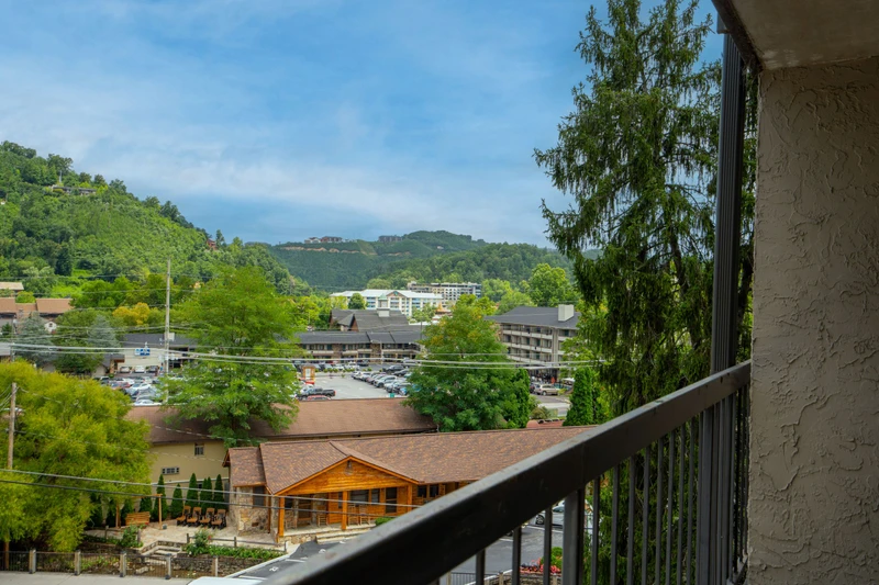 Your private balcony frames rolling green mountains and peaceful valley views—perfect for morning coffee or watching the day unwind.