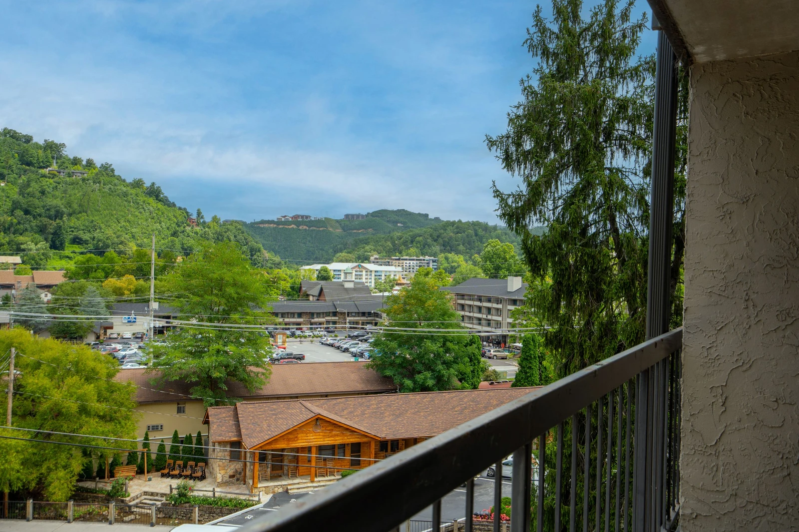 Your private balcony frames rolling green mountains and peaceful valley views—perfect for morning coffee or watching the day unwind.
