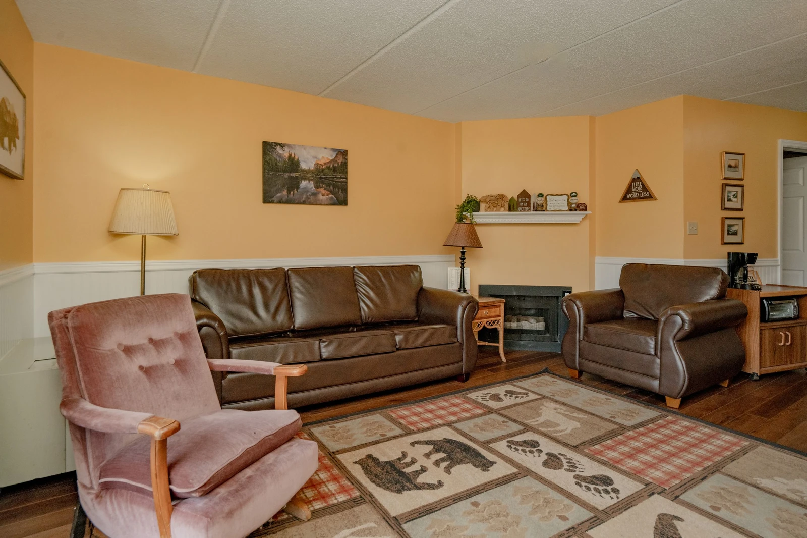 Settle into these comfy leather sofas and cozy armchairs after a day exploring—your peaceful home base awaits with warm lighting and rustic charm.