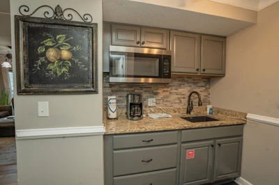 Your private kitchenette makes it easy to enjoy morning coffee or a quick snack, with granite countertops, a microwave, and all the essentials right at your fingertips.