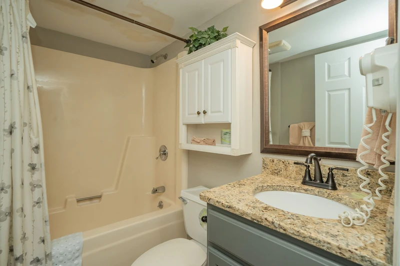 Step into your private bathroom with a granite-topped vanity, fresh towels, and a tub-shower combo—everything you need to unwind after a day of adventure.