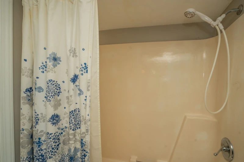 Step into your private shower after a day of adventure. The dual-head system and soothing beige tones create a peaceful space to rinse away the day's travels and refresh.