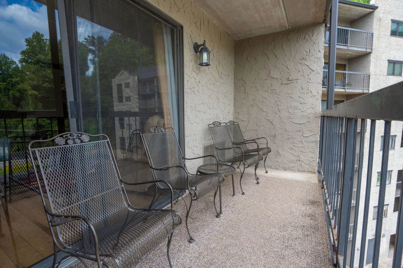 Relax on your private balcony with wrought-iron seating for two. The covered outdoor space gives you a peaceful spot to enjoy morning coffee or evening breezes while taking in views of the surrounding area.