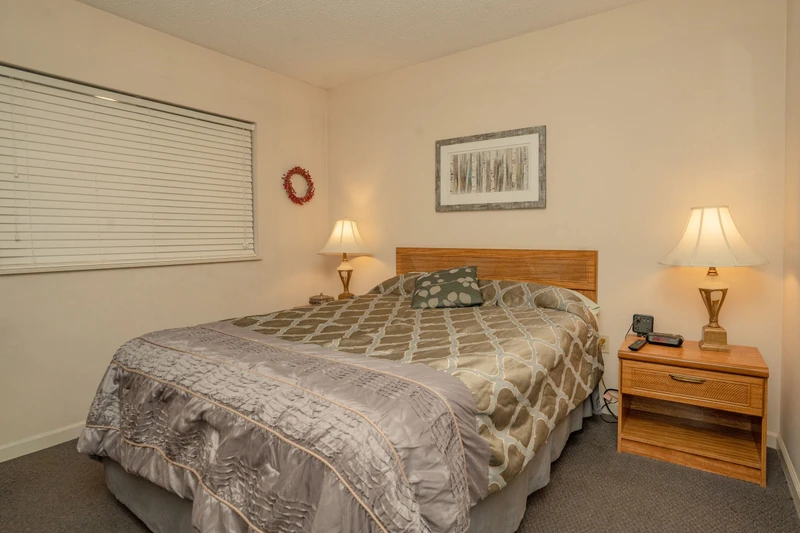 Settle into your cozy bedroom, where warm lamps and soft bedding create a peaceful retreat for restful nights during your stay.